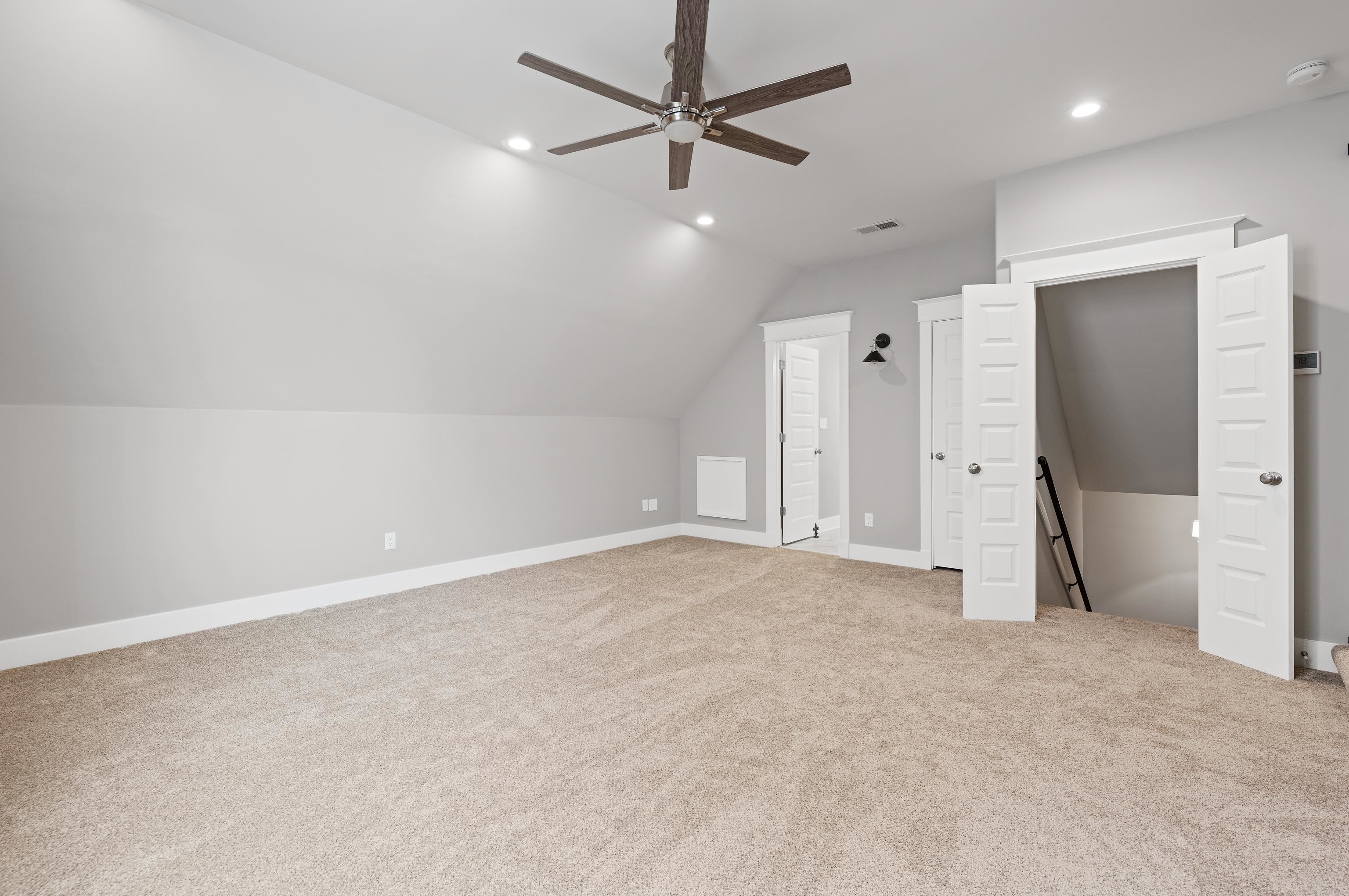 502 South Shea Road Collierville, TN 38017 - Photo 33 of 40 Bonus room featuring lofted ceiling, light carpet, and ceiling fan