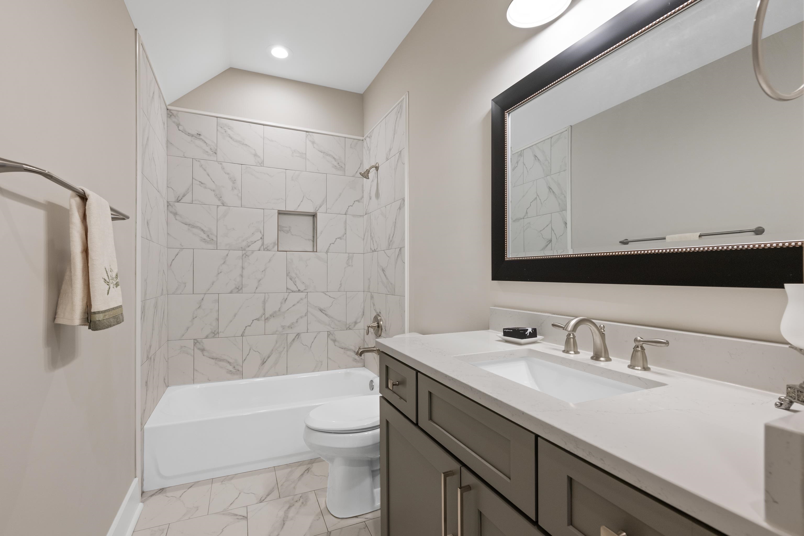 502 South Shea Road Collierville, TN 38017 - Photo 34 of 40 Full bathroom with tile patterned floors, toilet, vanity, and tiled shower / bath
