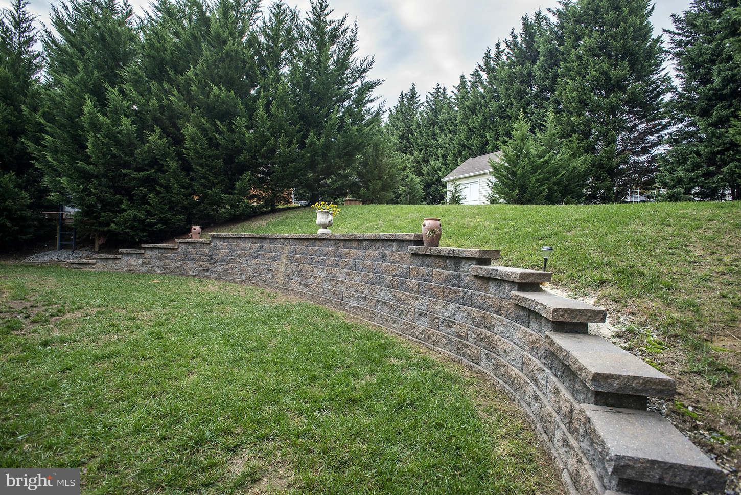 6209 Patuxent Quarter Road Elkridge, MD 21076 - Photo 25 of 28 Backyard & Retaining Wall