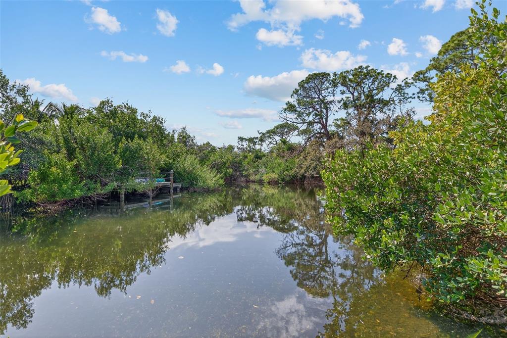 7108 Midnight Pass Road Sarasota, FL 34242 - Photo 57 of 83 a view of a lake in between two of trees