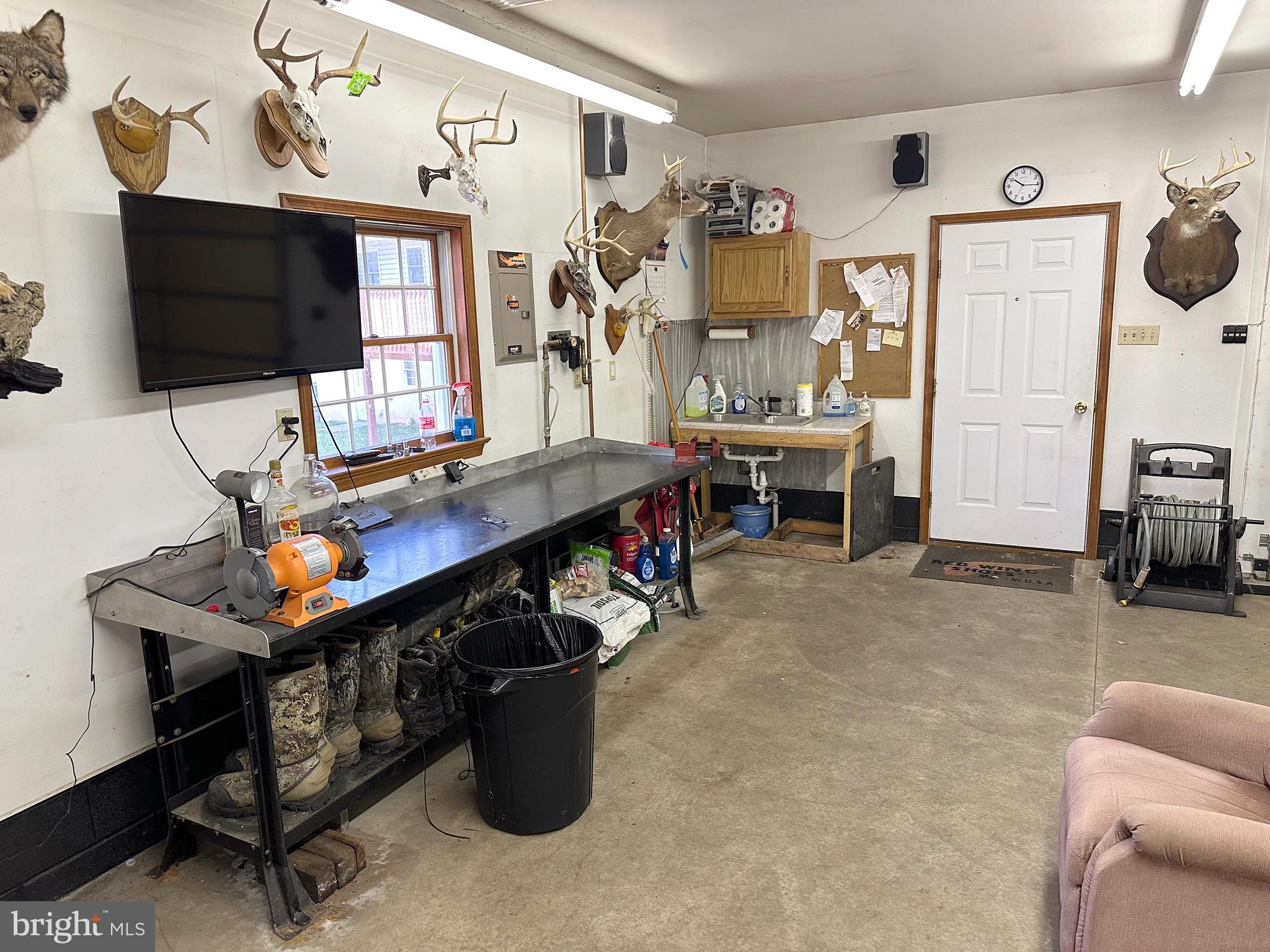 232 Old State Road Boyertown, PA 19512 - Photo 46 of 46 Workshop area and wash basin in detached garage