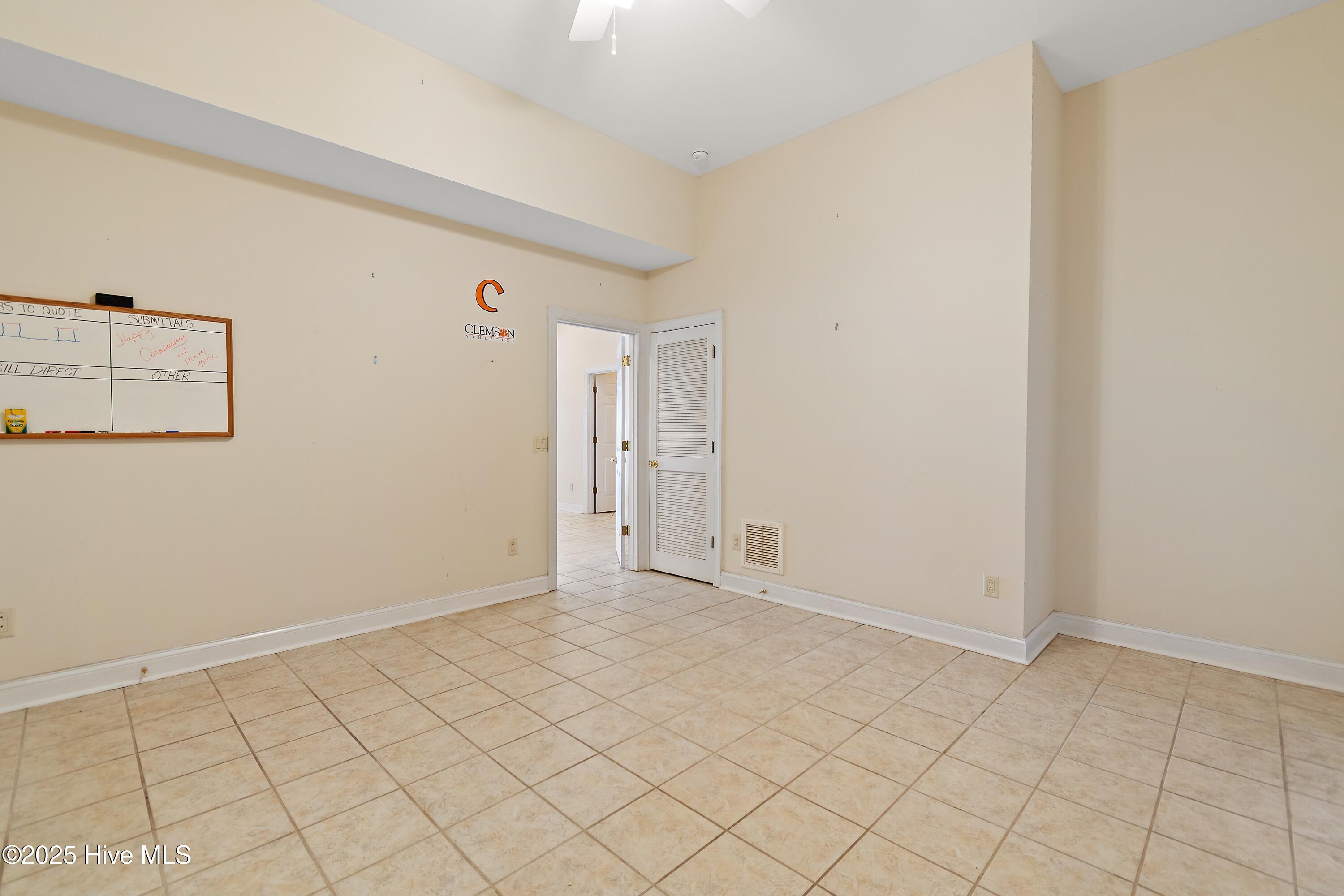 6777 Roberta Road Southwest Ocean Isle Beach, NC 28469 - Photo 65 of 89 Tiled Office area on bottom floor