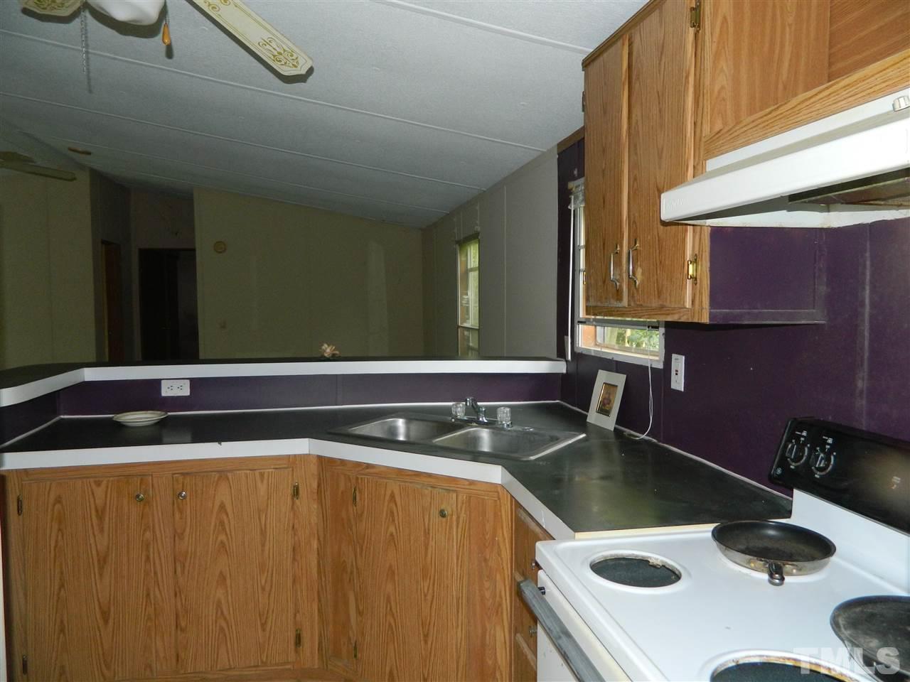 11977 Us 64 A Spring Spring Hope, NC 27882 - Photo 2 of 9 a bathroom with a sink and a mirror