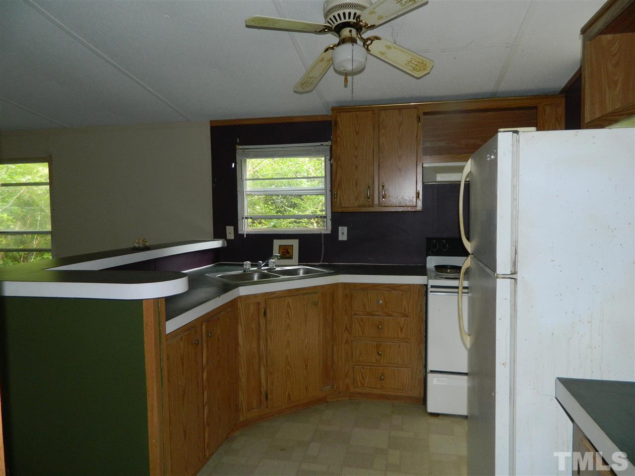 11977 Us 64 A Spring Spring Hope, NC 27882 - Photo 3 of 9 a kitchen with a refrigerator a sink and dishwasher