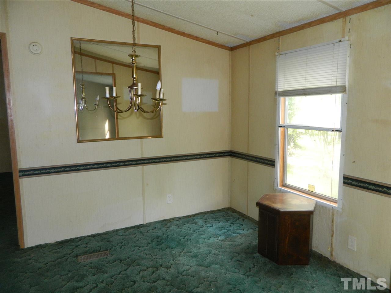 11977 Us 64 A Spring Spring Hope, NC 27882 - Photo 5 of 9 a room with window and a table