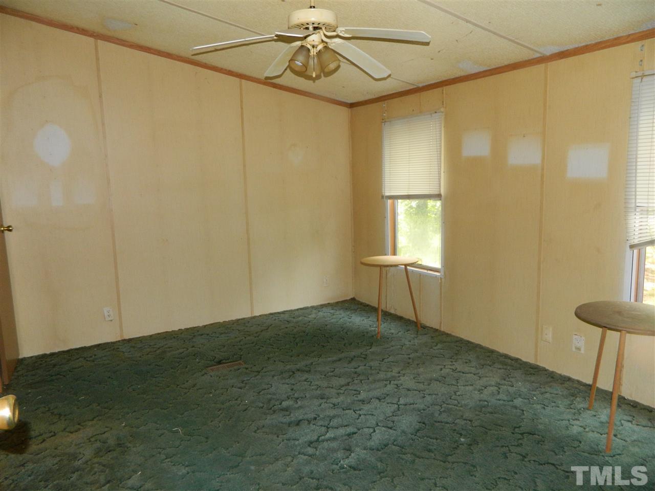 11977 Us 64 A Spring Spring Hope, NC 27882 - Photo 6 of 9 a view of empty room with windows