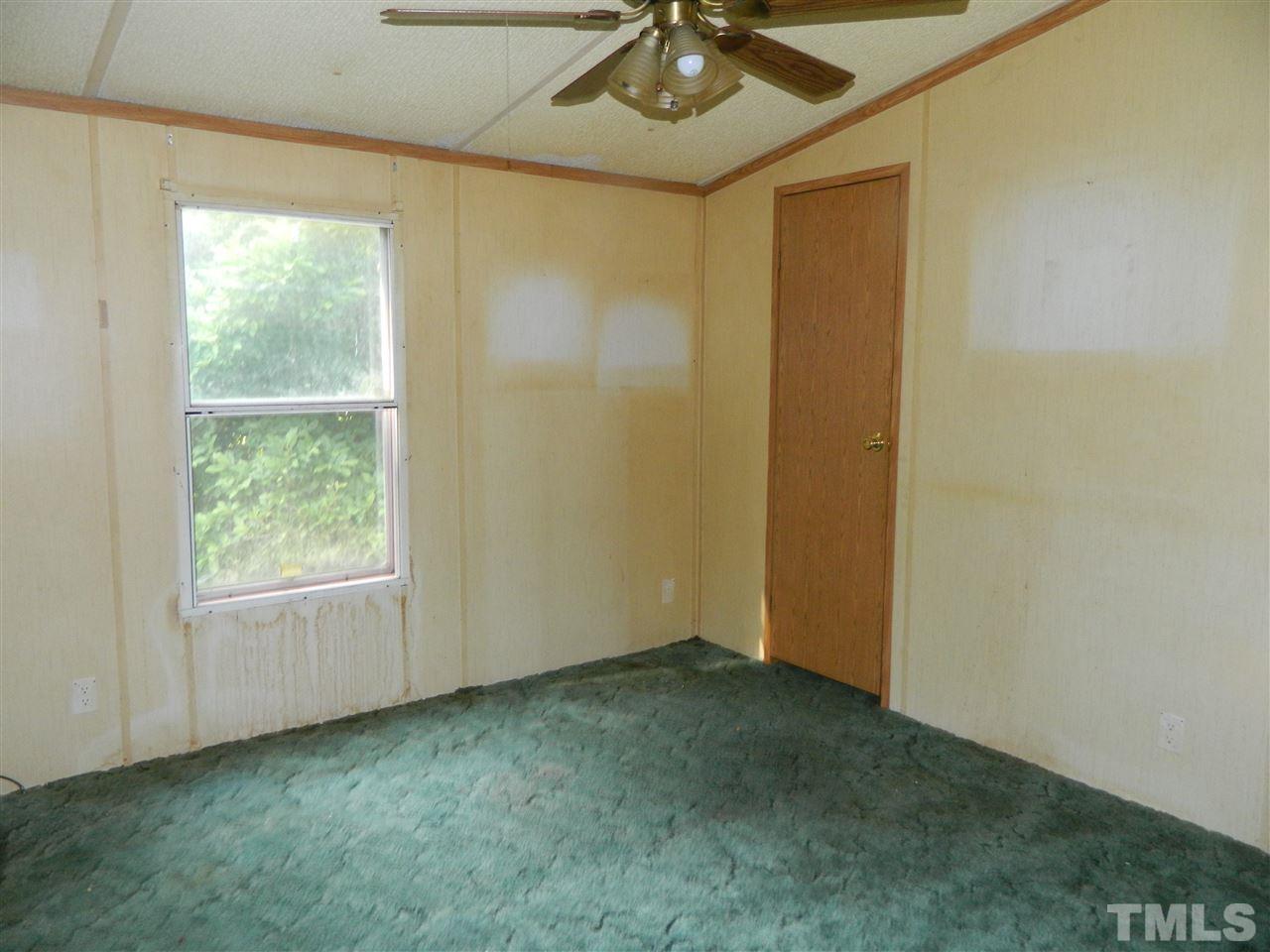 11977 Us 64 A Spring Spring Hope, NC 27882 - Photo 8 of 9 an empty room with a window