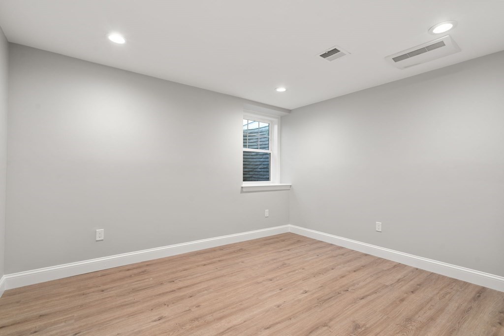 33 Riverside Street, Unit 33 Needham, MA 02494 - Photo 12 of 22 a view of a room with wooden floor and window