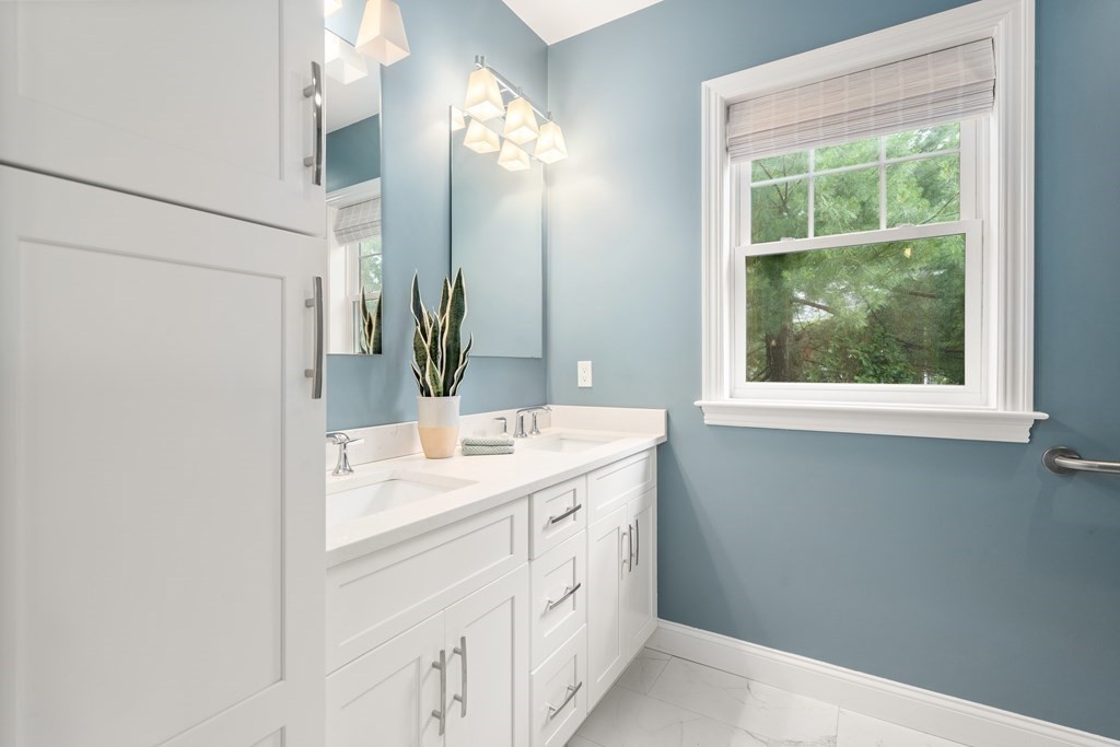 33 Riverside Street, Unit 33 Needham, MA 02494 - Photo 8 of 22 a bathroom with a sink and a mirror