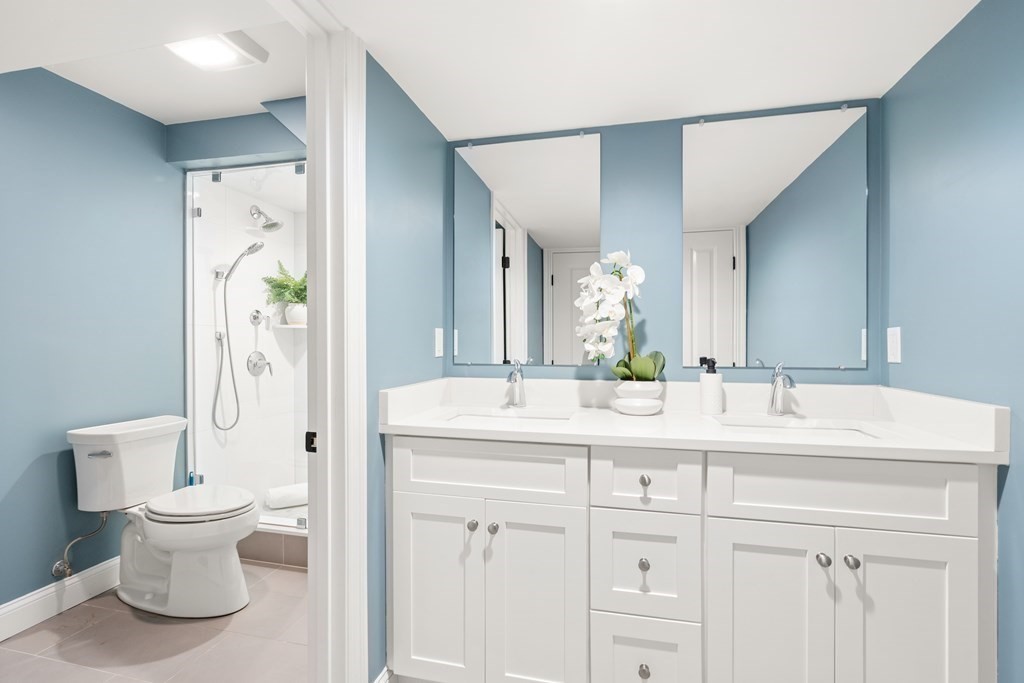 33 Riverside Street, Unit 33 Needham, MA 02494 - Photo 9 of 22 a bathroom with a sink toilet and shower