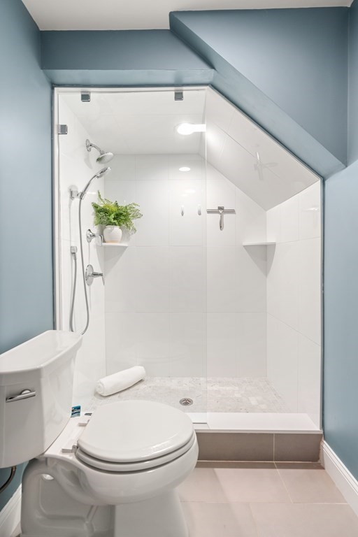 33 Riverside Street, Unit 33 Needham, MA 02494 - Photo 10 of 22 a white toilet sitting next to a bath tub