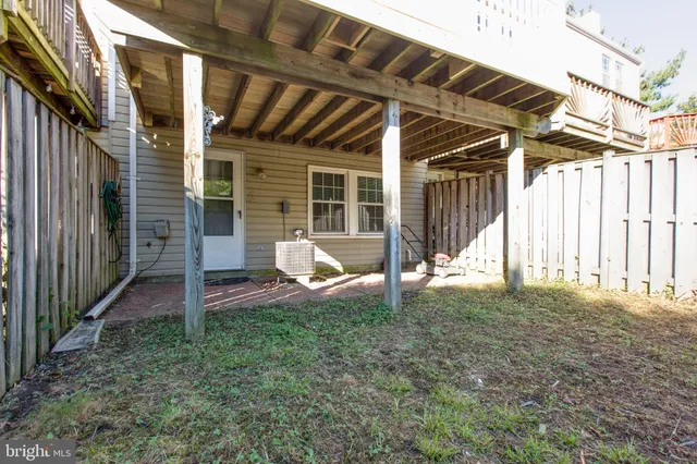 a view of a house with backyard and porch