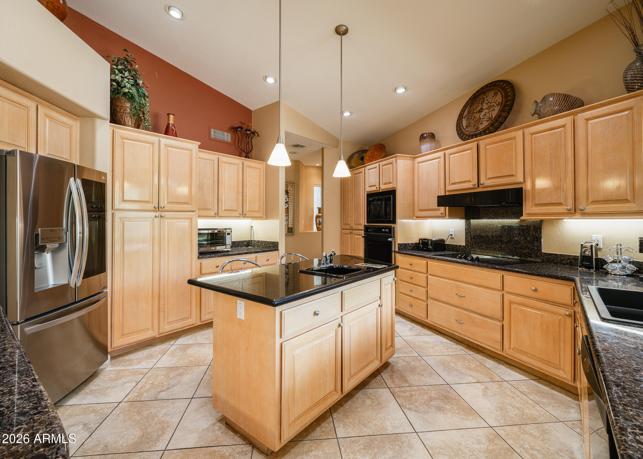 2329 East Hatcher Road Phoenix, AZ 85028 - Photo 3 of 40 a kitchen with stainless steel appliances granite countertop a sink a stove a refrigerator and cabinets