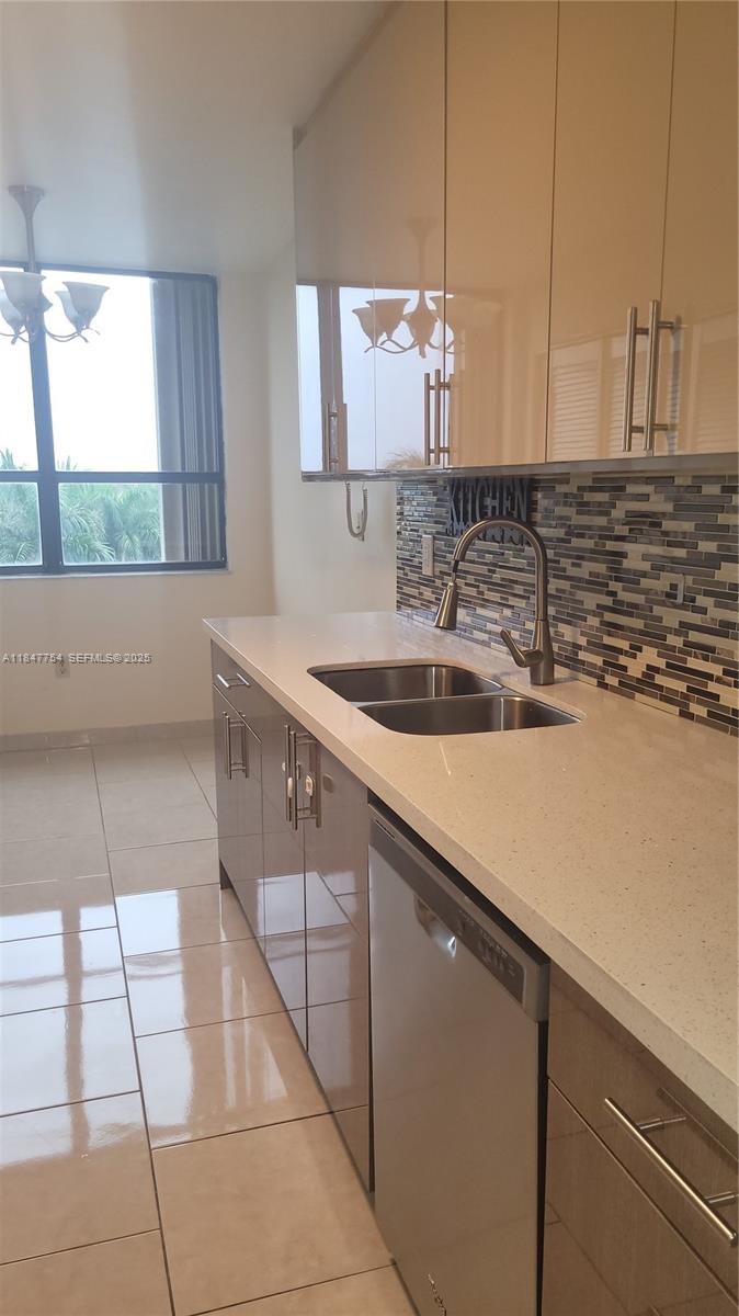 900 Northeast 195th Street, Unit 620 Miami, FL 33179 - Photo 12 of 28 a kitchen with a sink and cabinets