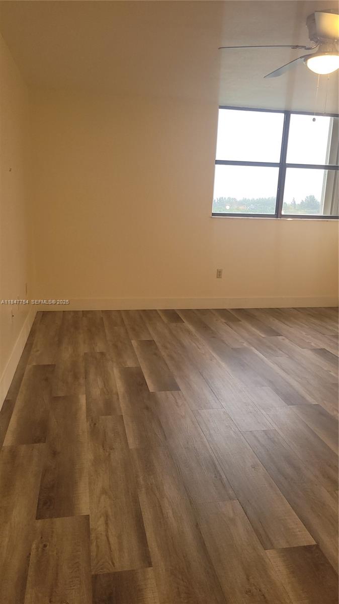 900 Northeast 195th Street, Unit 620 Miami, FL 33179 - Photo 21 of 28 an empty room with a window