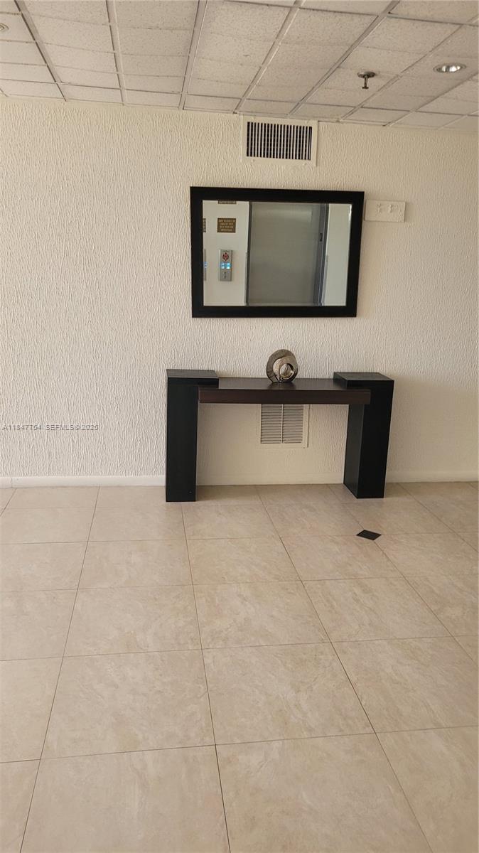 900 Northeast 195th Street, Unit 620 Miami, FL 33179 - Photo 25 of 28 a view of living room with a flat screen tv