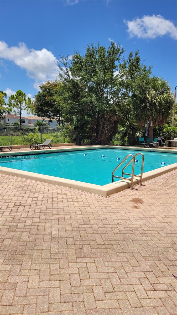900 Northeast 195th Street, Unit 620 Miami, FL 33179 - Photo 8 of 28 a view of an outdoor space and a yard