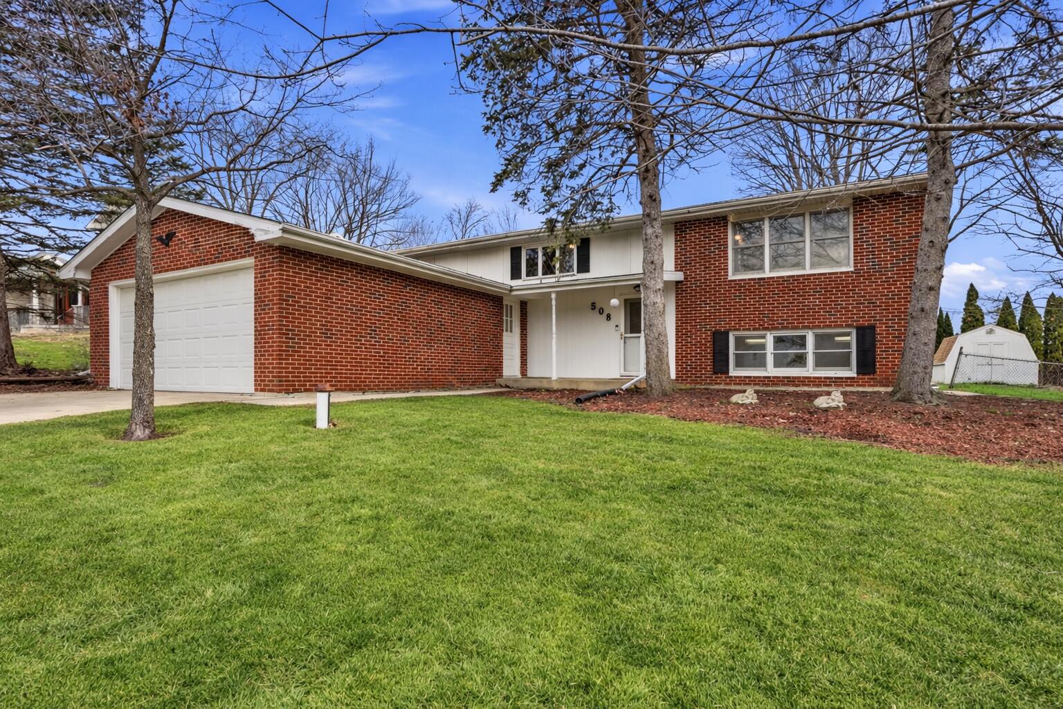 508 West 117th Place Crown Point, IN 46307 - Photo 1 of 20 a backyard of a house with lots of green space