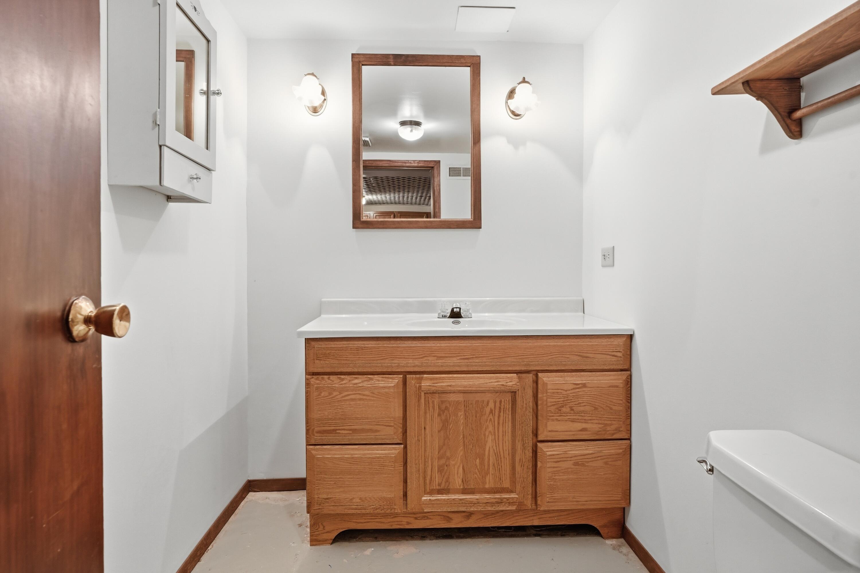 508 West 117th Place Crown Point, IN 46307 - Photo 15 of 20 a bathroom with a sink a toilet and mirror