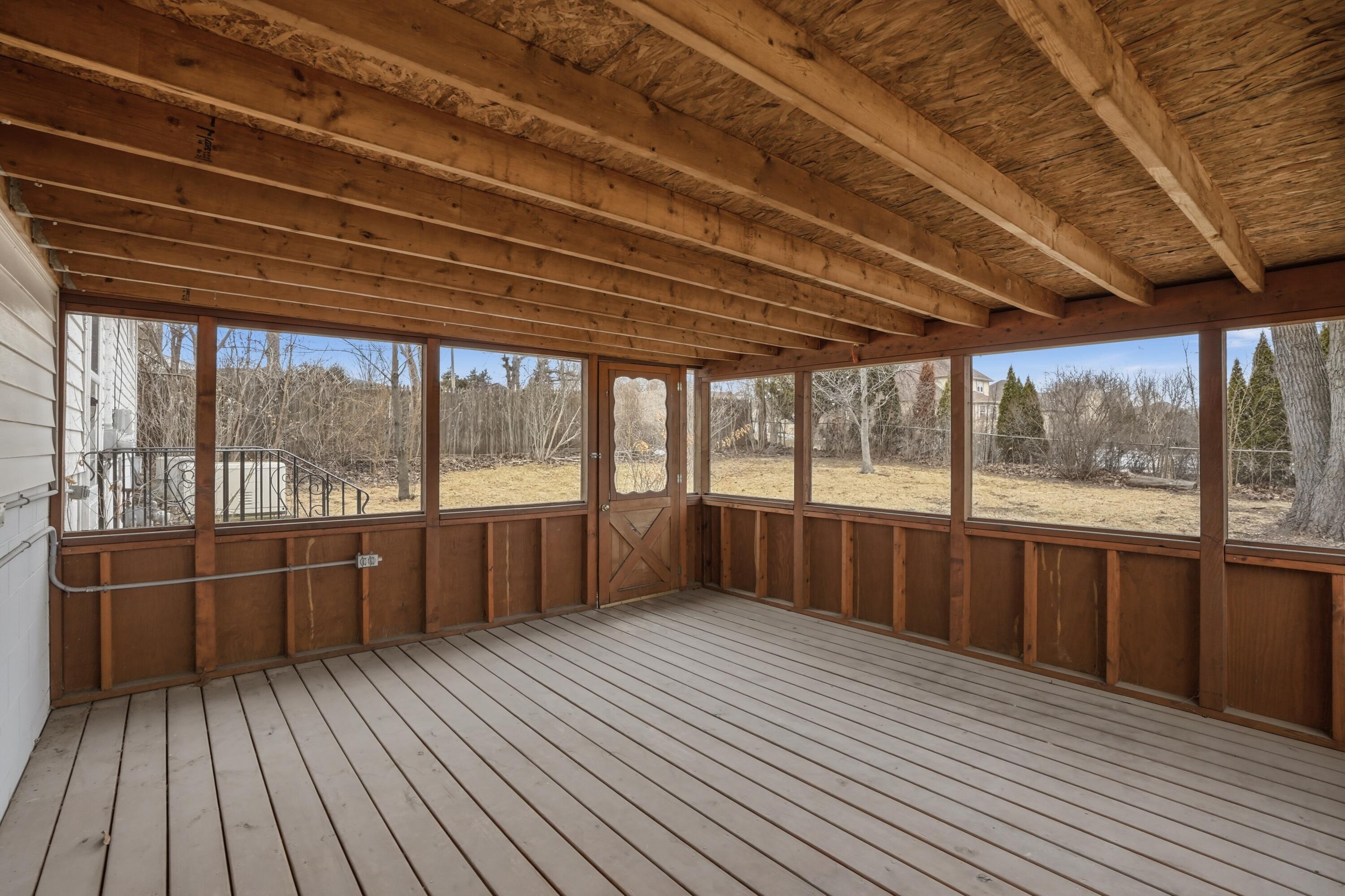 508 West 117th Place Crown Point, IN 46307 - Photo 18 of 20 a view of a balcony with wooden floor