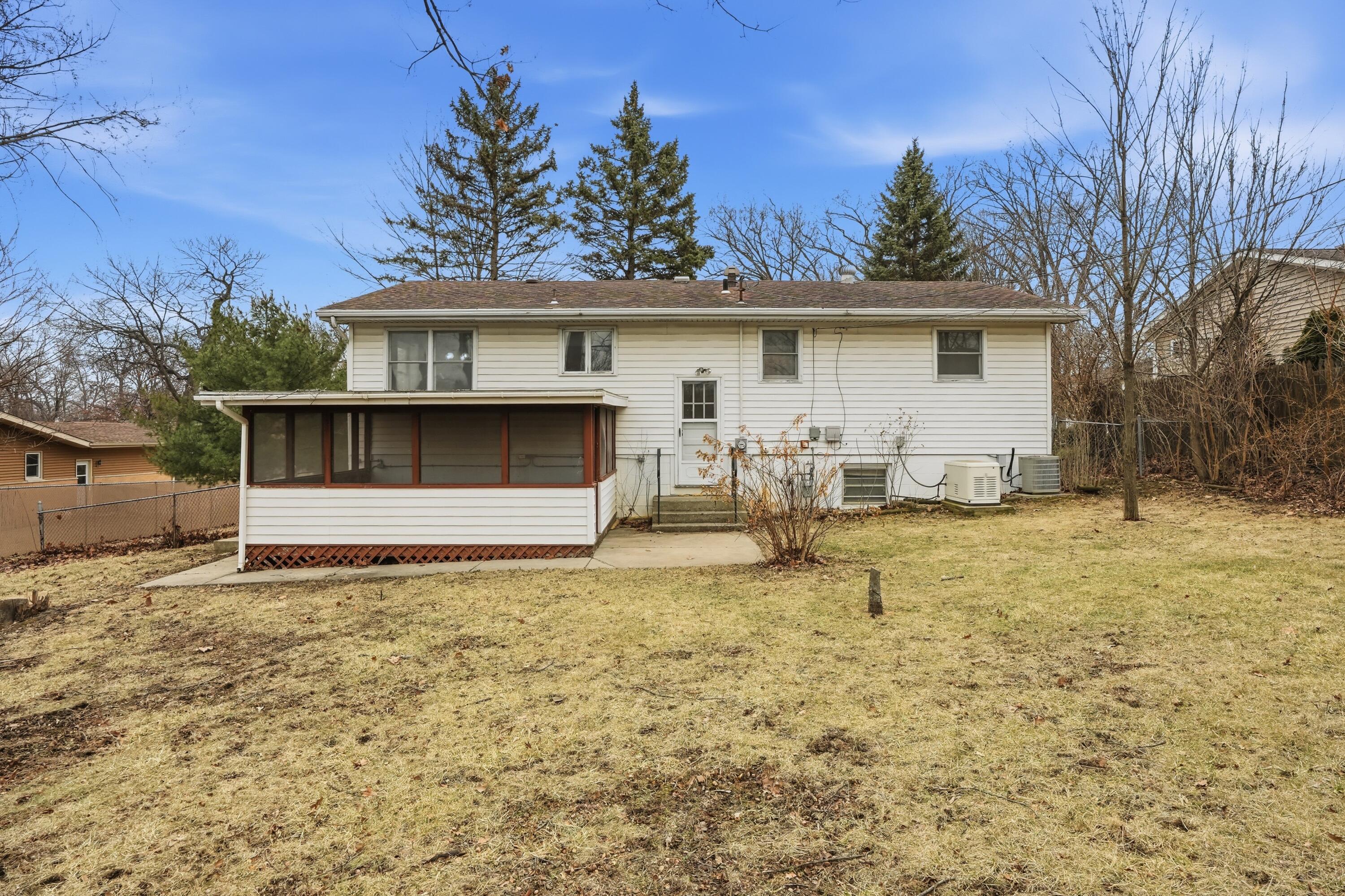508 West 117th Place Crown Point, IN 46307 - Photo 19 of 20 a view of a house with a large tree and a yard