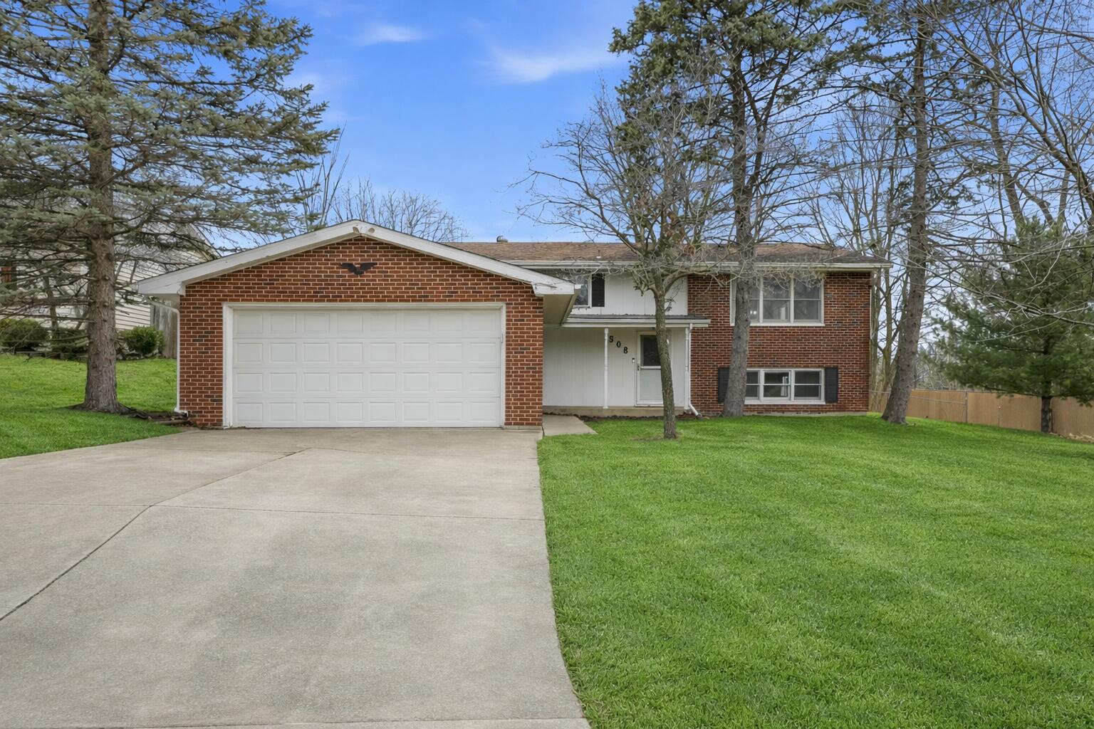 508 West 117th Place Crown Point, IN 46307 - Photo 2 of 20 a front view of a house with a garden and yard