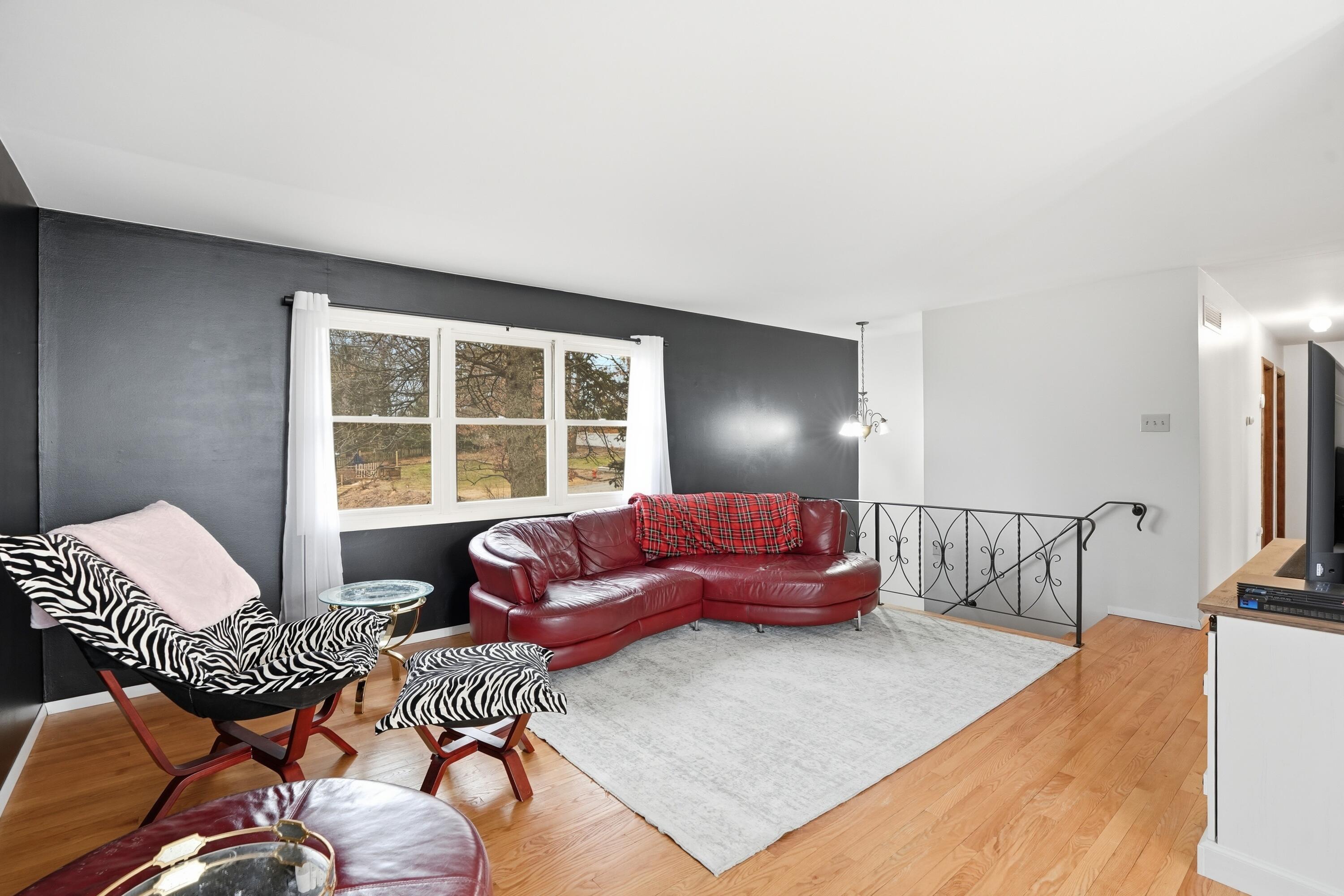 508 West 117th Place Crown Point, IN 46307 - Photo 3 of 20 a living room with furniture and a floor to ceiling window