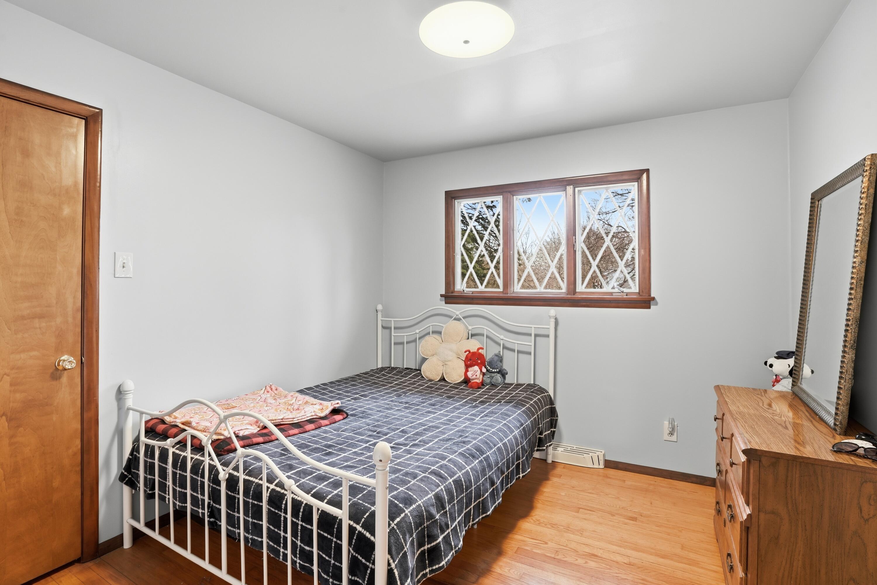 508 West 117th Place Crown Point, IN 46307 - Photo 9 of 20 a bedroom with a bed and a flat screen tv