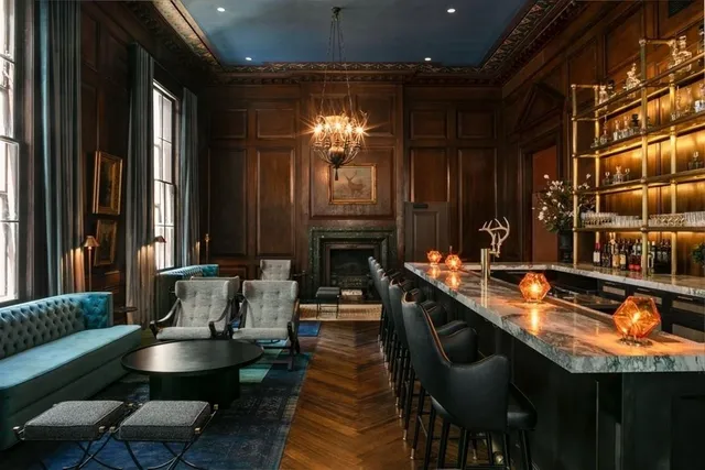 a dining room with furniture and a fireplace