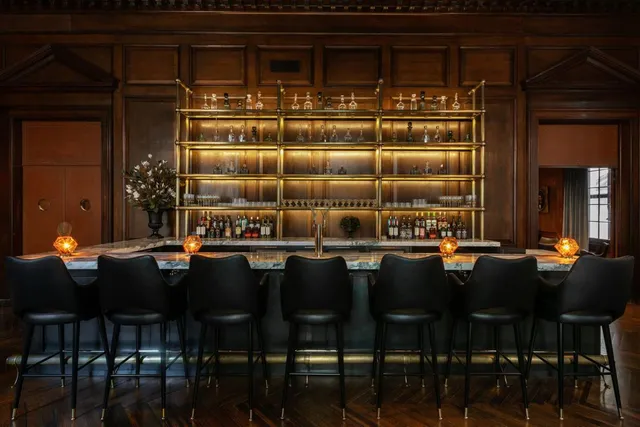 a dining area with chairs and table