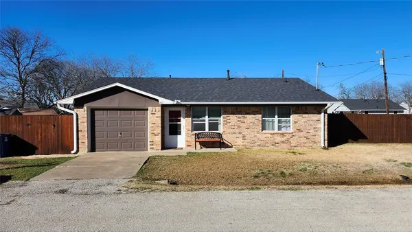 a house with yard in front of it