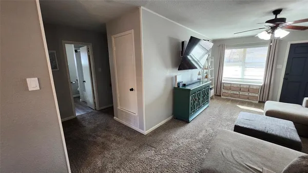 a view of livingroom with furniture and window