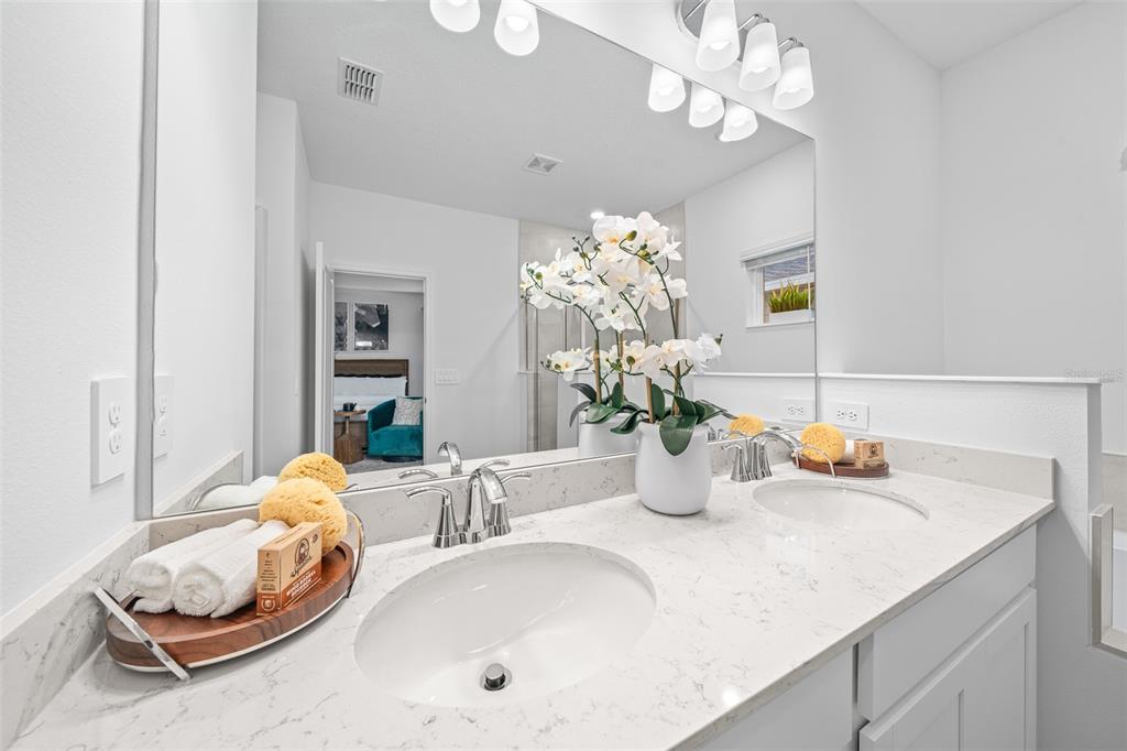 6880 Southwest 87th Street Ocala, FL 34476 - Photo 31 of 36 a bathroom with a sink a vanity and a mirror