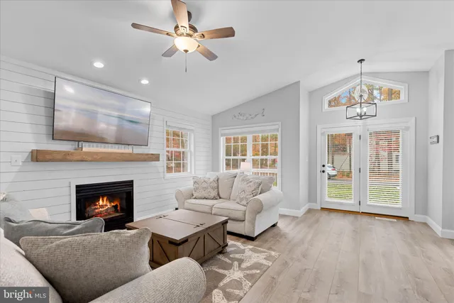 a kitchen with white cabinets stainless steel appliances and sink