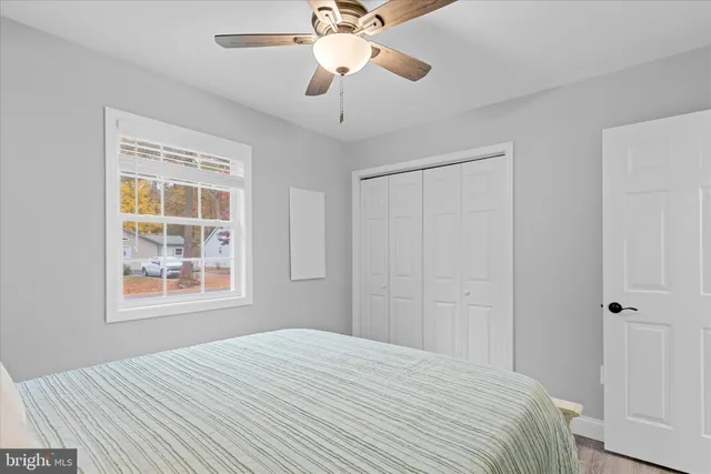 a view of a yard with swimming pool and green space