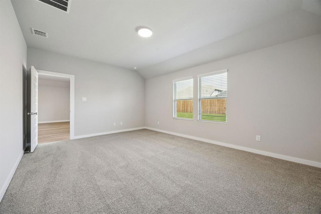 521 Sierra Ridge Lavon, TX 75166 - Photo 13 of 29 an empty room with windows and closet