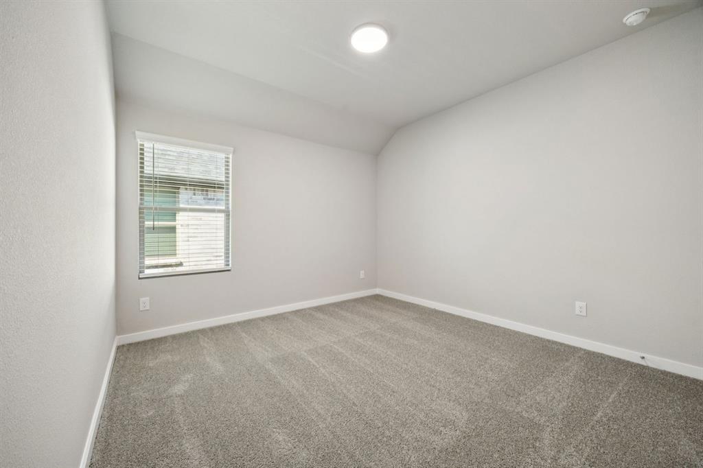 521 Sierra Ridge Lavon, TX 75166 - Photo 19 of 29 an empty room with a window