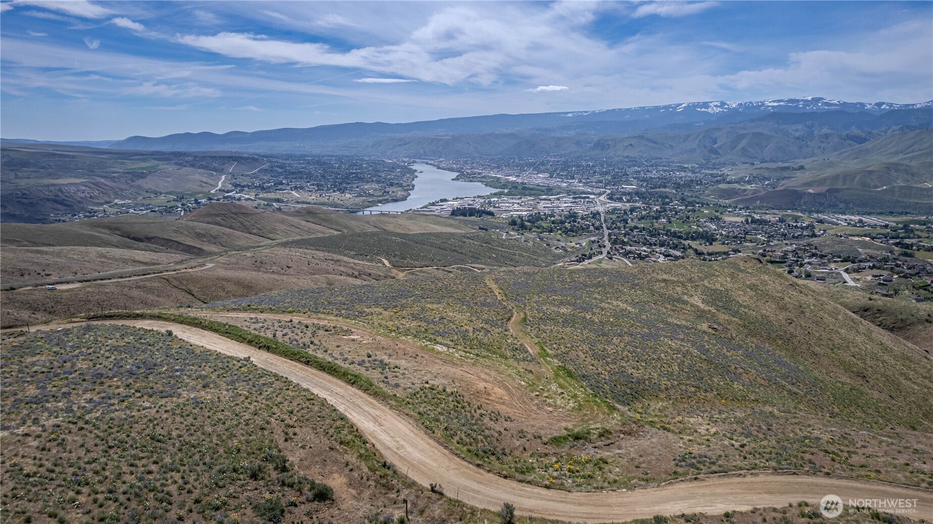 1 Burch Mountain Road Wenatchee, WA 98801 - Photo 17 of 34 a view of a dry yard with mountains in the background