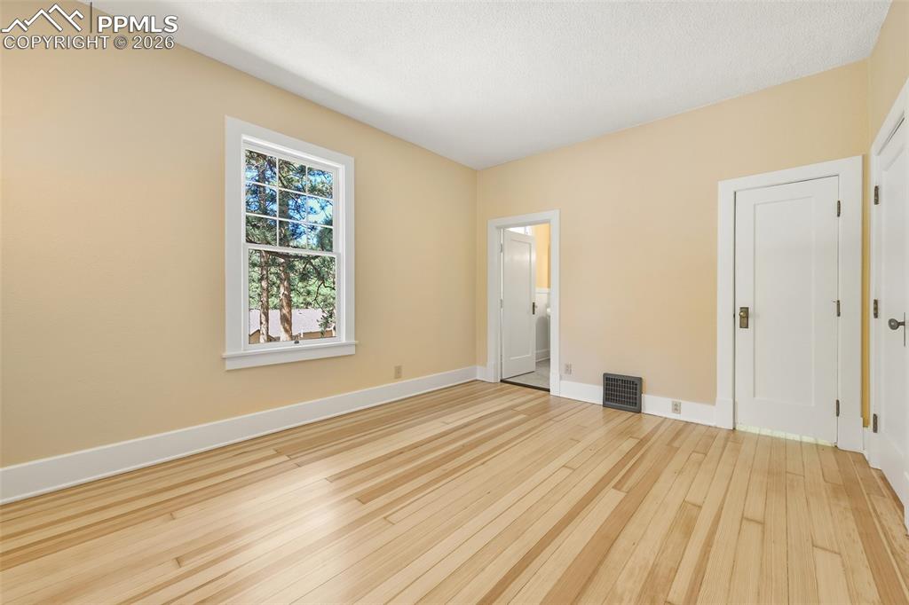 4530 Hagerman Road Cascade, CO 80809 - Photo 24 of 47 Primary Bedroom With View Of Door To Walk-In Closet