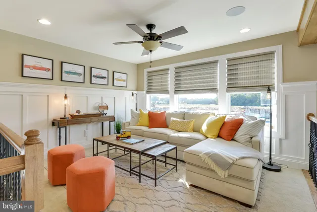 a bedroom with a bed and ceiling fan