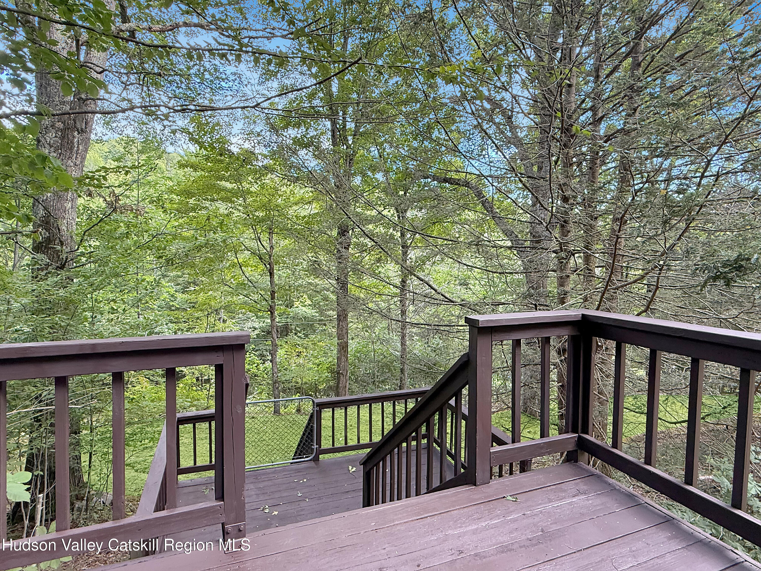 289 Red Falls Road Ashland, NY 12468 - Photo 37 of 44 a view of a balcony with wooden floor and fence