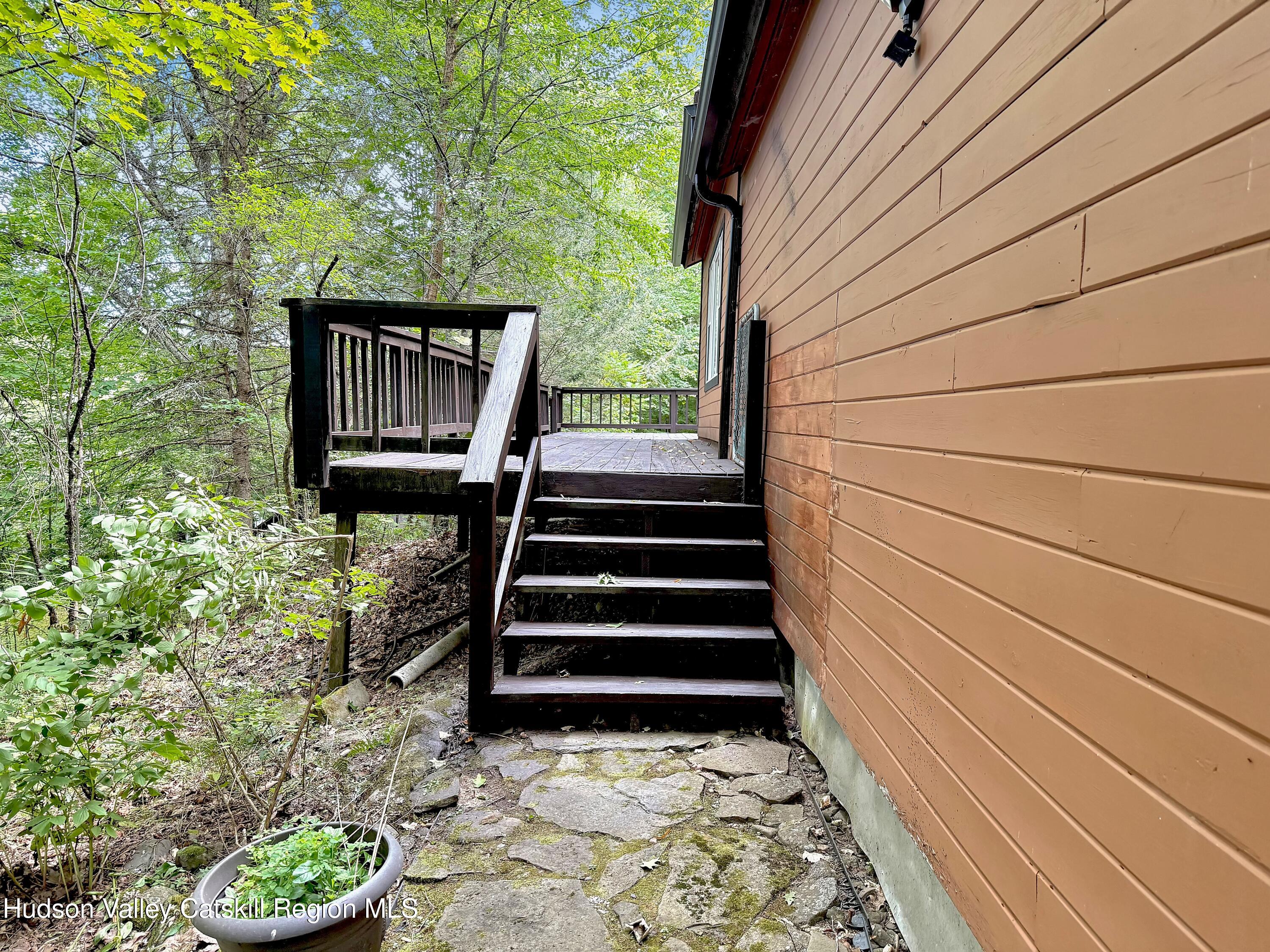 289 Red Falls Road Ashland, NY 12468 - Photo 6 of 44 a view of a pathway both side of house