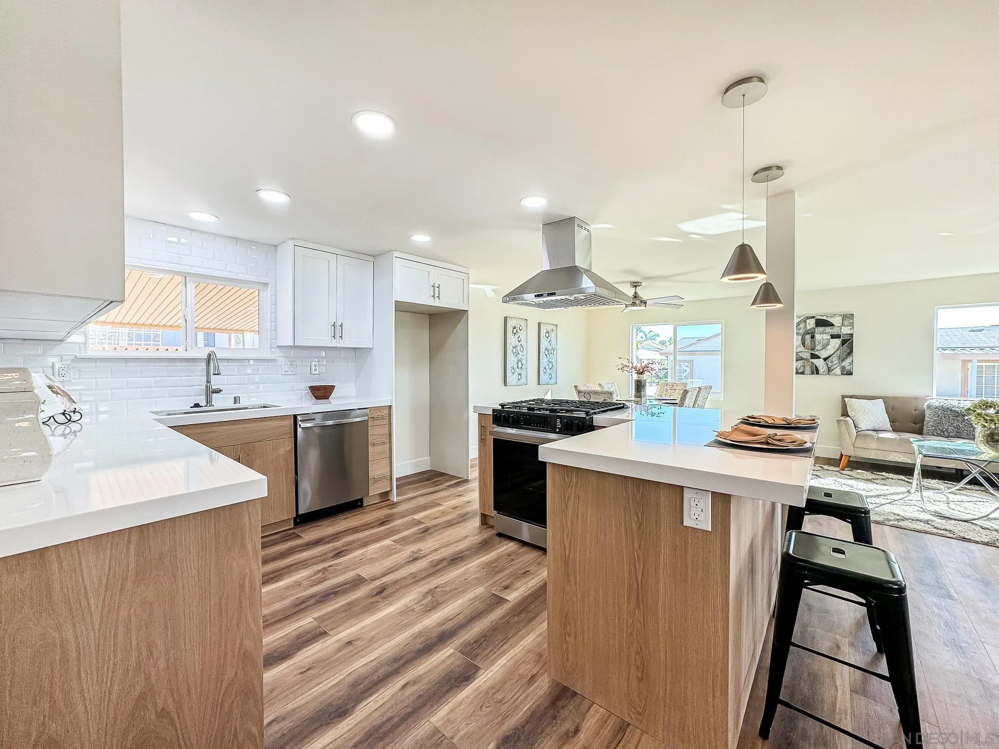 154 Falls View Lane Oceanside, CA 92056 - Photo 11 of 45 a kitchen with a sink a counter top space stainless steel appliances and cabinets