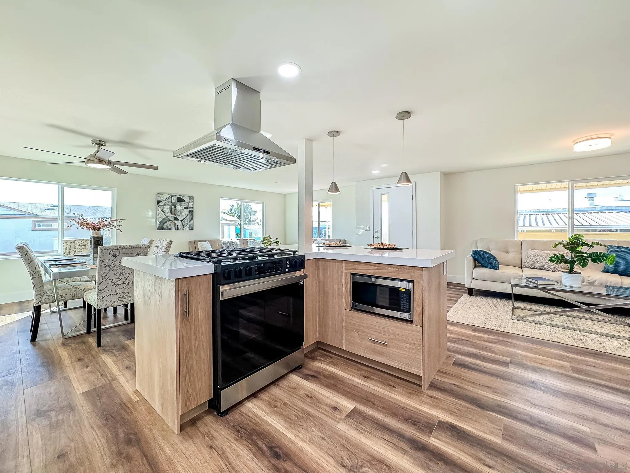154 Falls View Lane Oceanside, CA 92056 - Photo 13 of 45 a kitchen with a stove oven and chairs