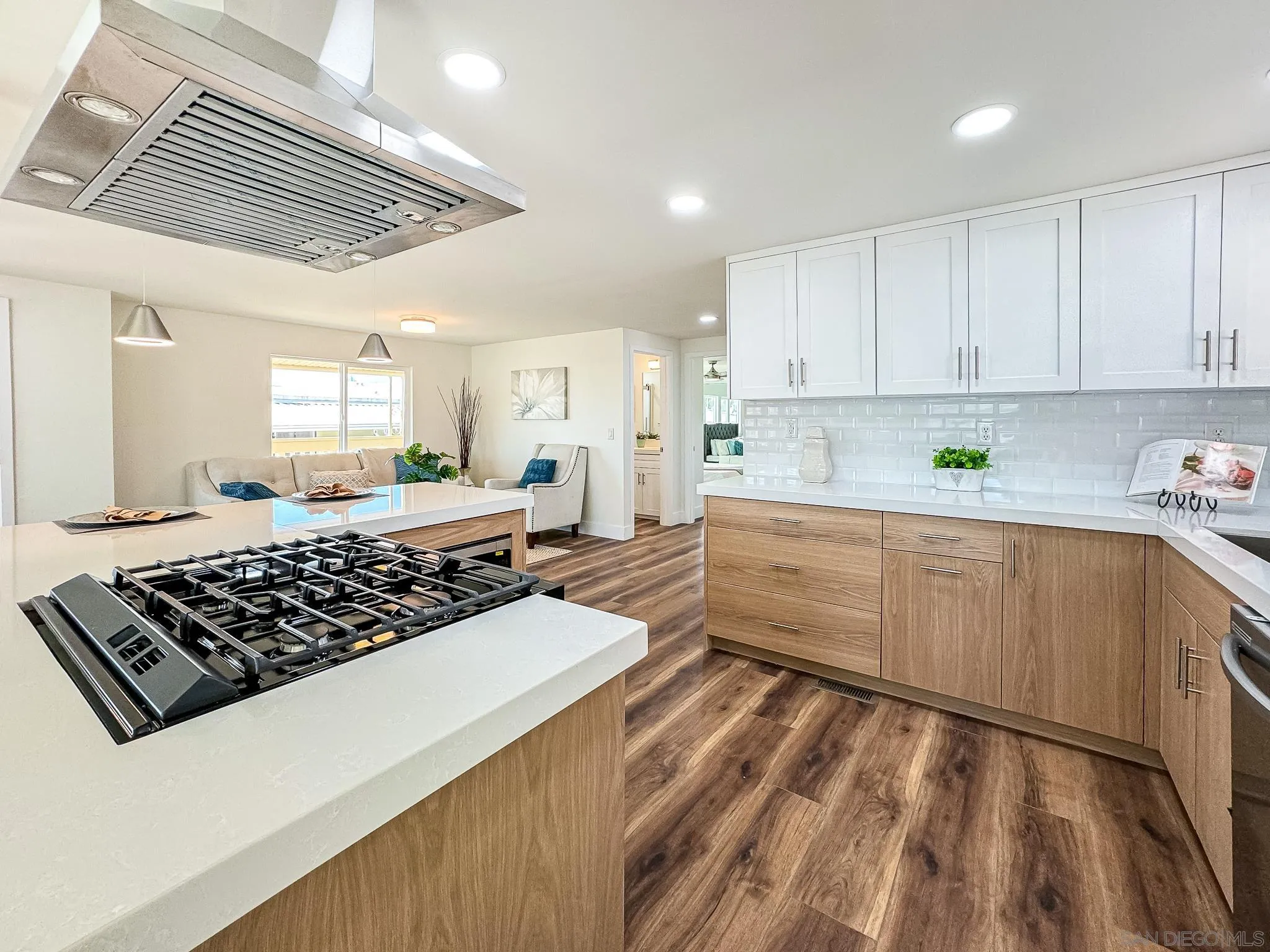 154 Falls View Lane Oceanside, CA 92056 - Photo 15 of 45 a kitchen with stainless steel appliances a stove a sink and cabinets