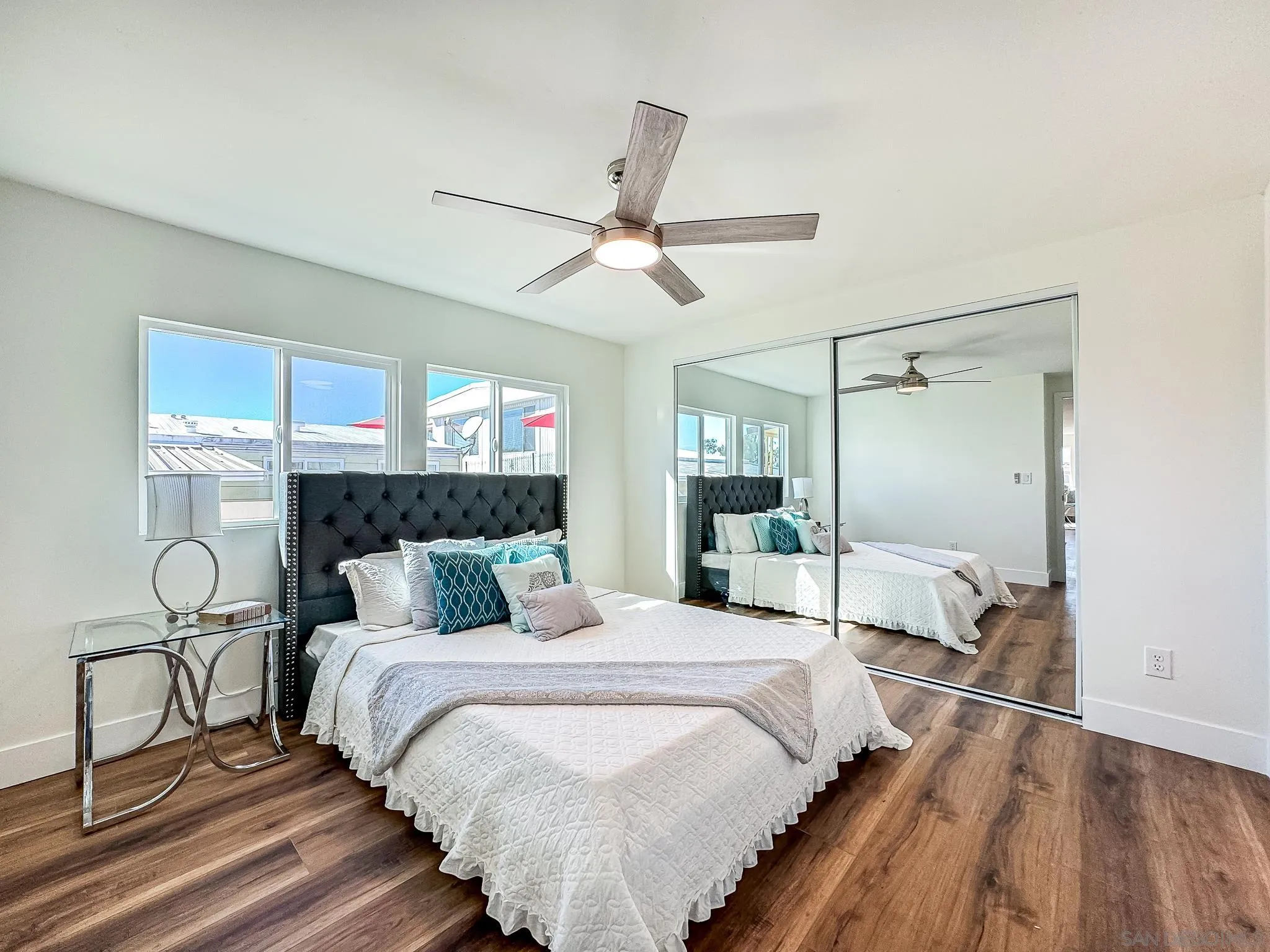 154 Falls View Lane Oceanside, CA 92056 - Photo 18 of 45 a bedroom with a bed and a mirror