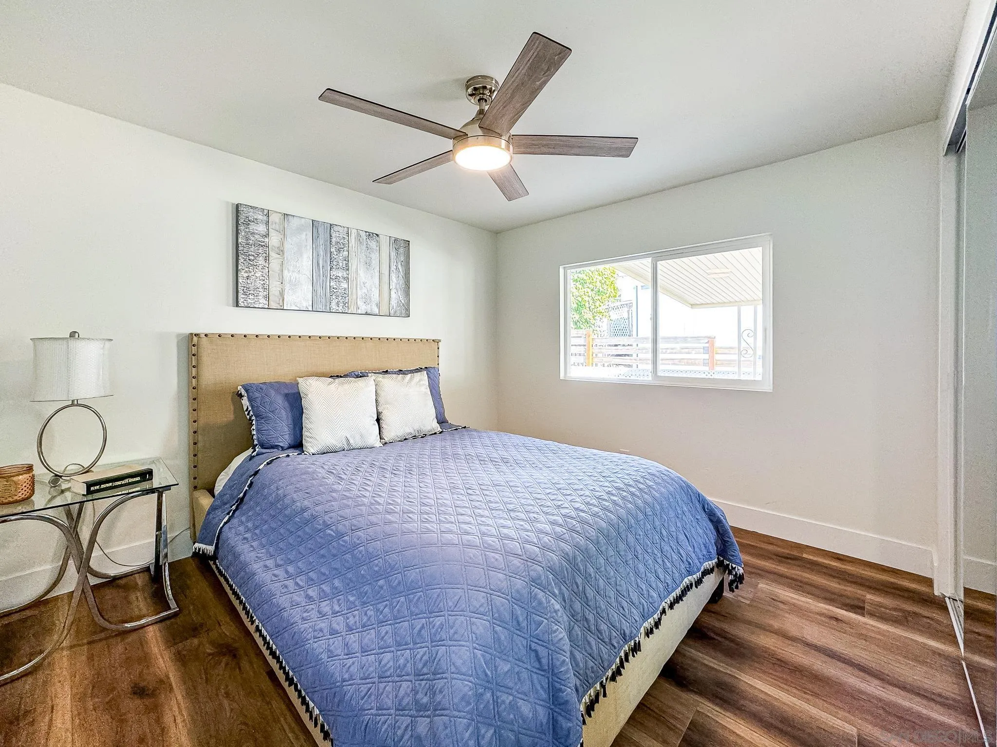 154 Falls View Lane Oceanside, CA 92056 - Photo 27 of 45 a bedroom with a bed and window