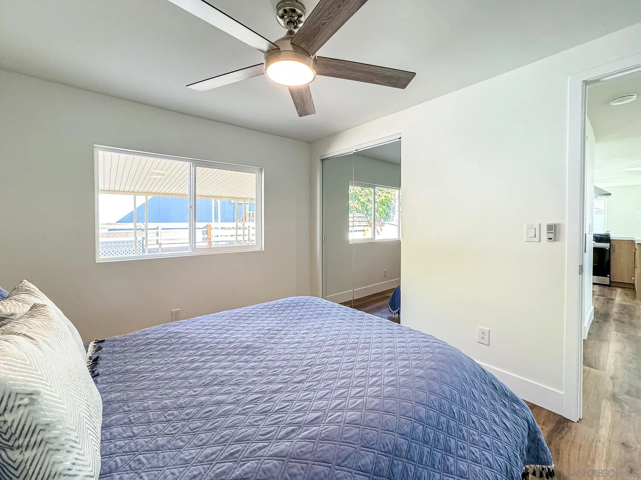 154 Falls View Lane Oceanside, CA 92056 - Photo 28 of 45 a bedroom with a bed and a window