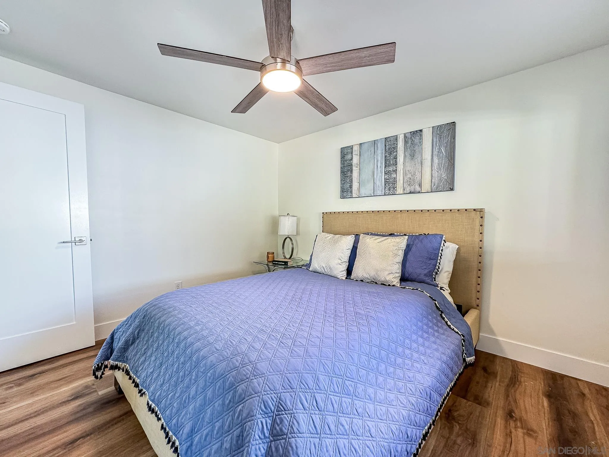 154 Falls View Lane Oceanside, CA 92056 - Photo 29 of 45 a bedroom with a large bed and a chandelier