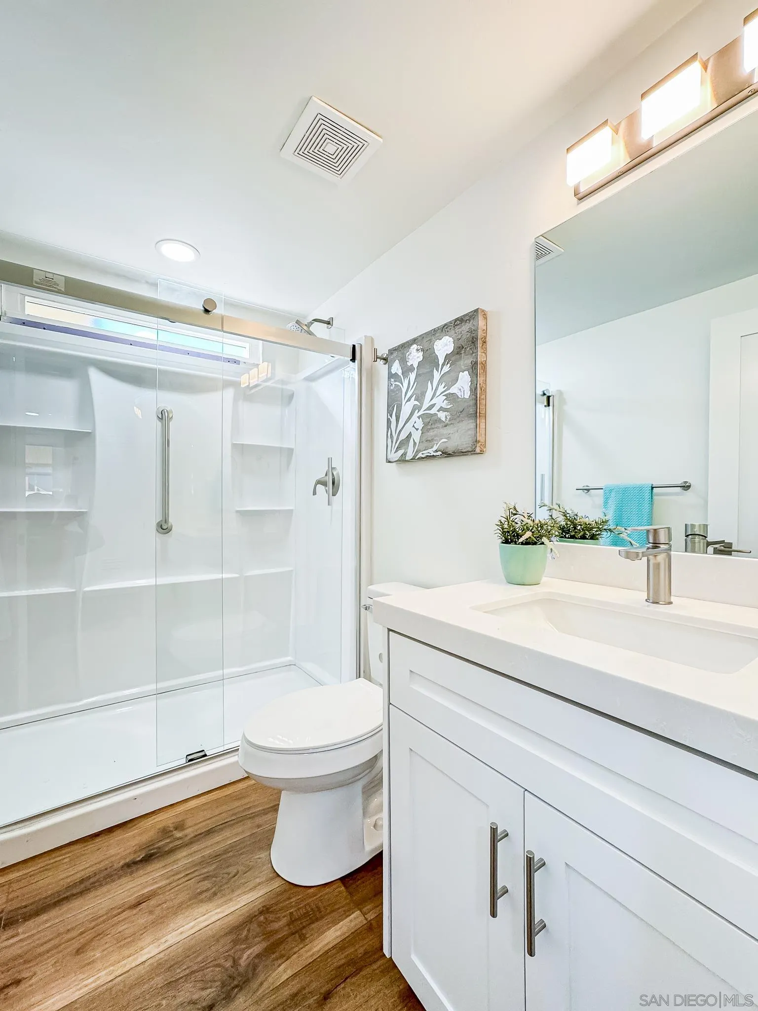 154 Falls View Lane Oceanside, CA 92056 - Photo 30 of 45 a bathroom with a sink a toilet and shower
